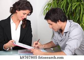 Man signing documents