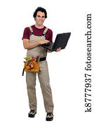 Carpenter with laptop computer Carpenter with laptop computer