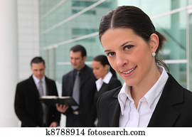 Business colleagues stood outside building