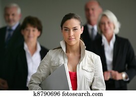 An intern posing with her superiors