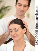 Man giving his wife a head massage