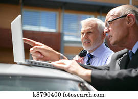 Senior business team visiting client