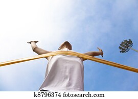 Winning athlete with cloud background Winning athlete with cloud background
