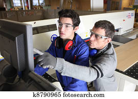 young apprentice in industry sector with tutor