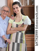 Young woman in an apron with an elderly lady