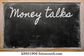 expression -  Money talks - written on a school blackboard with 