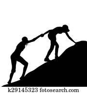 Girl giving helping hand to her friend to climb up the last section of mountain Girl giving helping hand to her friend to climb up the last section of mountain