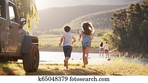 Excited Family Reaching Countryside Destination On Road Trip Excited Family Reaching Countryside Destination On Road Trip