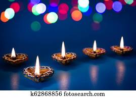 Happy Diwali - Clay Diya lamps lit during Dipavali, Hindu festival of lights celebration Happy Diwali - Clay Diya lamps lit during Dipavali, Hindu festival of lights celebration