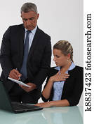 Boss checking something with assistant