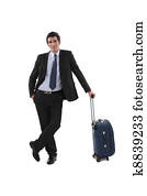 Businessman with luggage stood waiting
