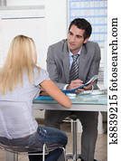 Young woman in interview with trainer