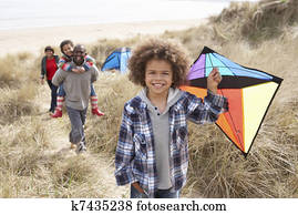 Family Having Fun With Kite In Sand Dunes Family Having Fun With Kite In Sand Dunes