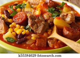 Cape Verde food: Cachupa with meat, chorizo and vegetables macro. horizontal