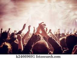 Large group of people enjoying concert