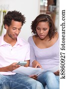 Couple calculating their budget