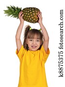Little girl with pineapple
