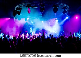 People dancing at the concert, anonymous girls on the stage People dancing at the concert, anonymous girls on the stage