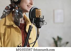 Woman recording a song