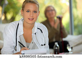 A nurse visiting an elderly patient at home