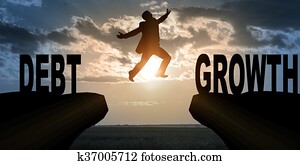 Businessman with hopping over abyss