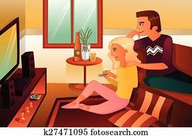 Couple watching TV  at home