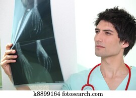 doctor examining a x-ray image