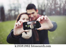 Cute young couple taking a self portrait
