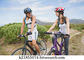Athletic couple mountain biking