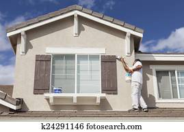 House Painter Painting the Trim And Shutters of Home House Painter Painting the Trim And Shutters of Home