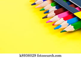 Pencils on yellow background.