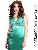 Luxury. Shapely Woman in Silky Sleeveless Classic Dress