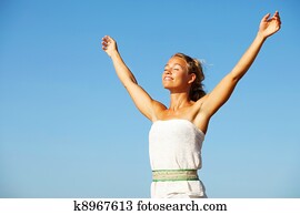 Young woman with arms raised Young woman with arms raised
