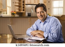 Man paying bills on computer.