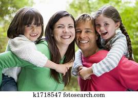 Family outdoors smiling Family outdoors smiling