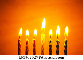 The symbol of the traditional holiday Kwanzaa seven candles for the background. The symbol of the traditional holiday Kwanzaa seven candles for the background.