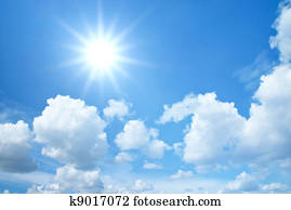 Blue sky with clouds and sun
