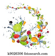 Fresh fruits falling in water splash, isolated on white background Fresh fruits falling in water splash, isolated on white background