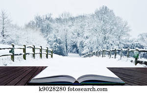 Winter wonderland snow landscape in pages of magic book