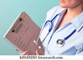 Female doctor holding medical record