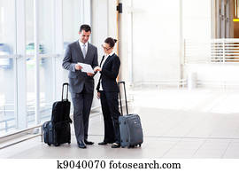 two businesspeople meeting at airport two businesspeople meeting at airport