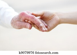 Senior and Young Women Holding Hands Senior and Young Women Holding Hands
