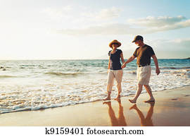 Senior Couple Enjoying Sunset at the Beach