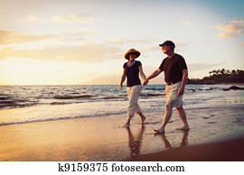Senior Couple Enjoying Sunset at the Beach