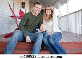 Happy Young Family on Porch
