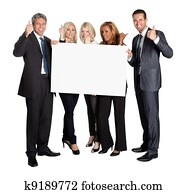 Business people with thumbs up holding blank board