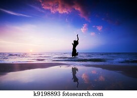 Happy jump jumping on beach