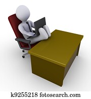 Businessman with feet on desk working with laptop