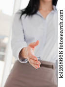 A woman with her hand outstretched