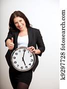 A Business Professional Holding a Clock A Business Professional Holding a Clock